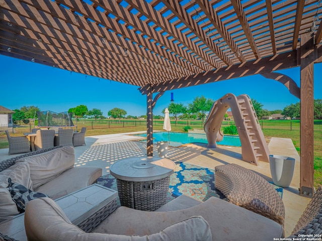 view of patio with a fenced in pool, a pergola, and a trampoline