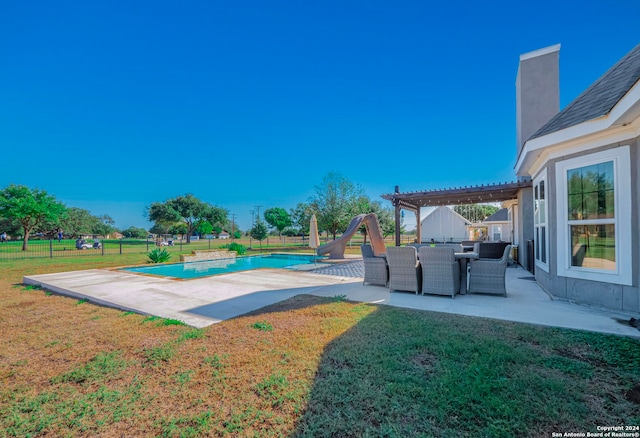 view of pool with a water slide, a pergola, a patio, and a yard