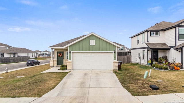 view of front of house with a garage and a front yard