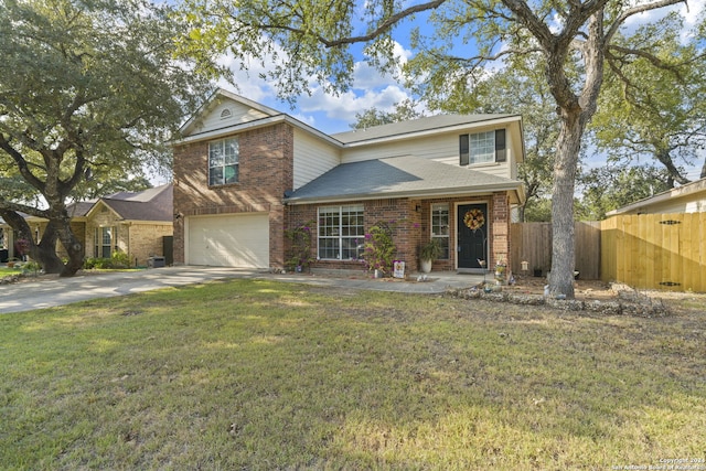 view of front of house with a garage and a front yard