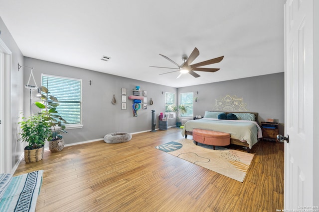 bedroom featuring light hardwood / wood-style flooring and ceiling fan