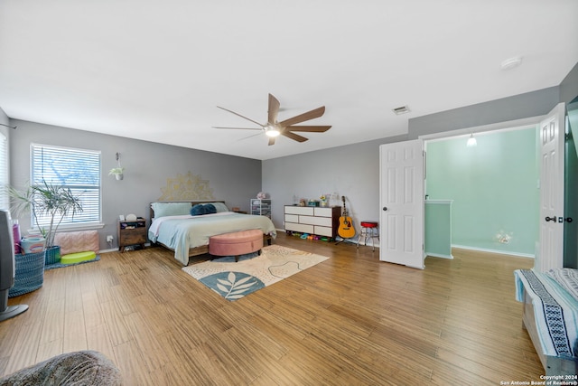 bedroom featuring hardwood / wood-style floors and ceiling fan