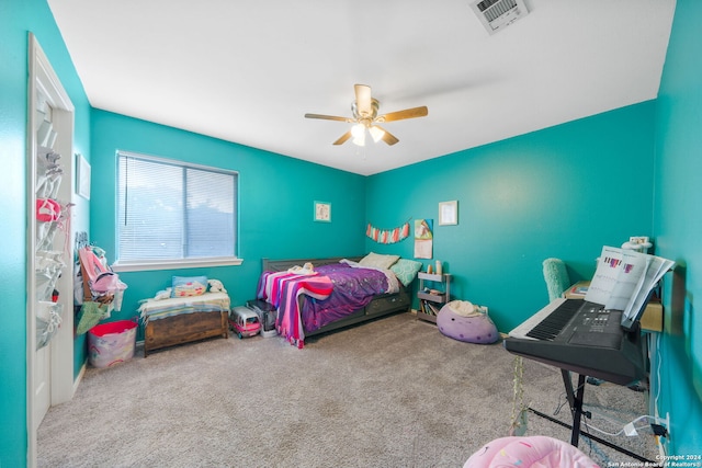 bedroom featuring ceiling fan and carpet