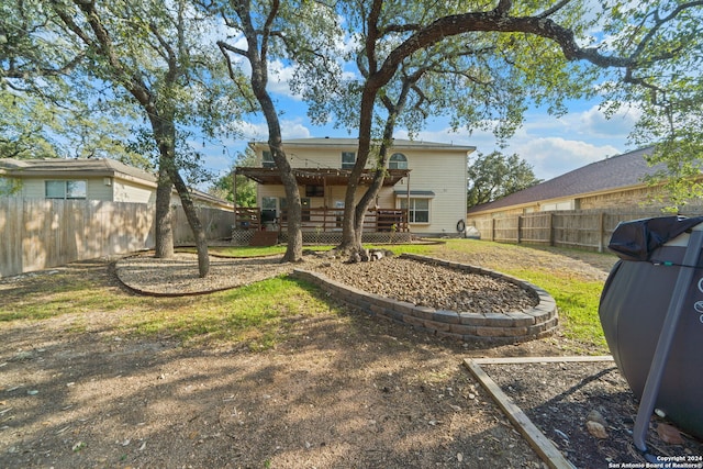 back of property with a lawn