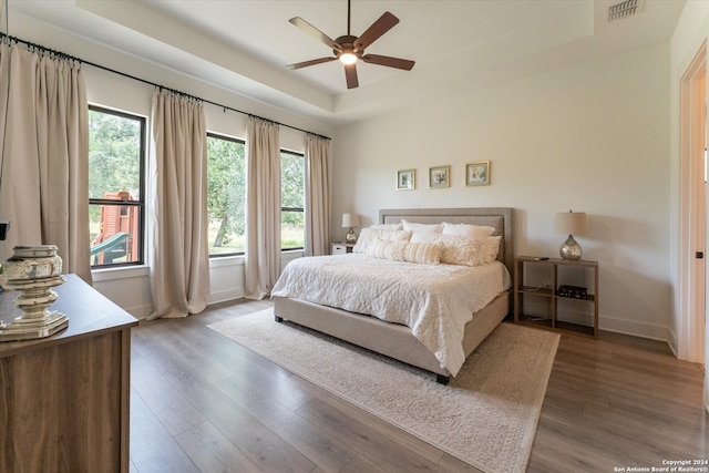 bedroom featuring hardwood / wood-style flooring and ceiling fan