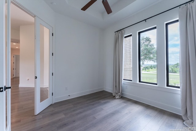 unfurnished room featuring hardwood / wood-style flooring and ceiling fan