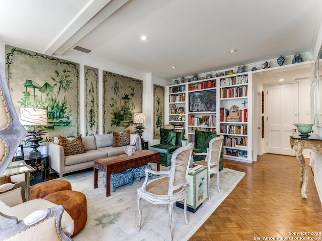 sitting room with light parquet floors and beamed ceiling