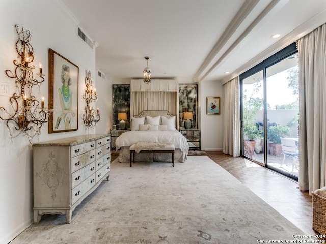 bedroom featuring ornamental molding and access to outside