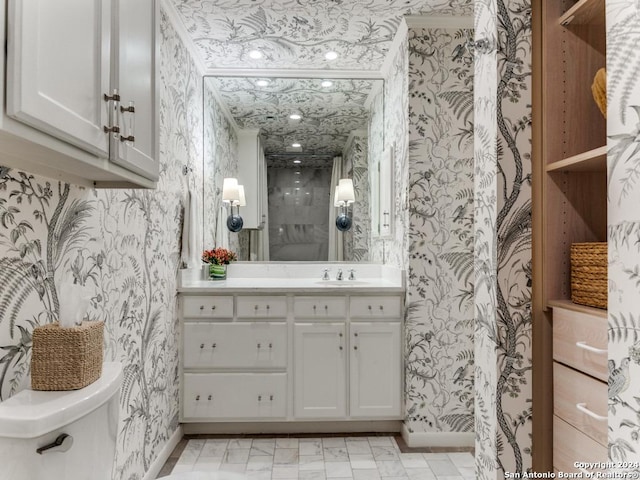 bathroom with toilet and vanity