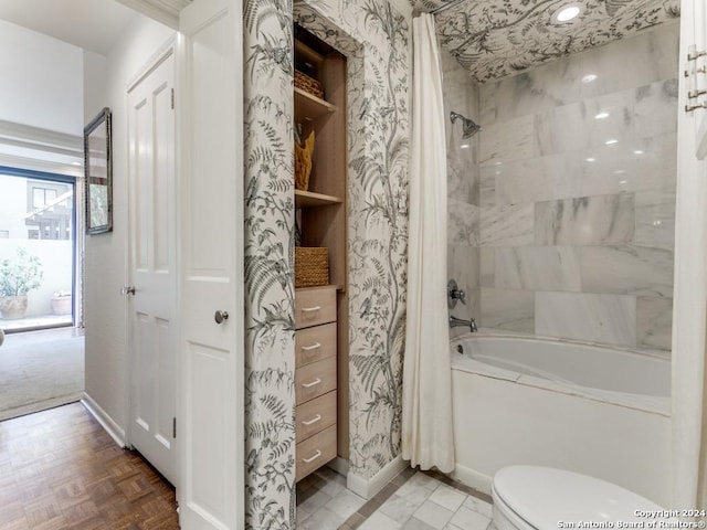 bathroom featuring toilet and shower / bath combo