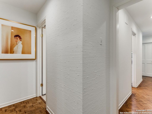 corridor with dark parquet flooring