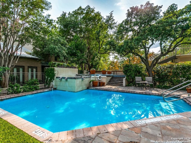 view of swimming pool featuring a patio