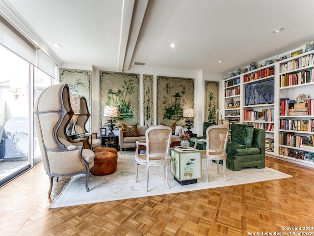 sitting room featuring light parquet flooring and beam ceiling