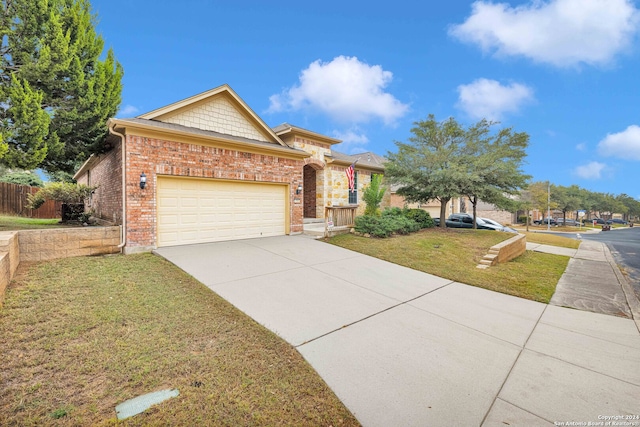 view of front of property featuring a garage and a front lawn