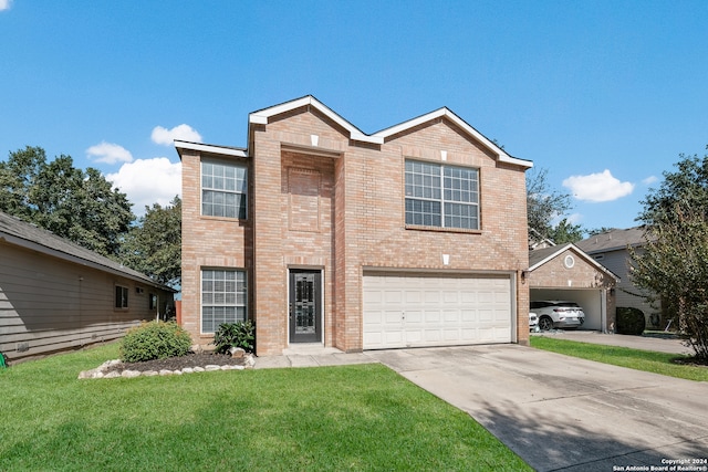 traditional-style house with a front yard, concrete driveway, brick siding, and an attached garage