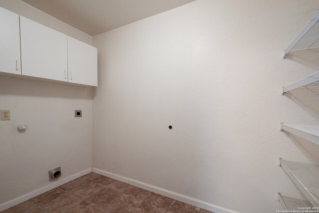 washroom featuring cabinets and electric dryer hookup