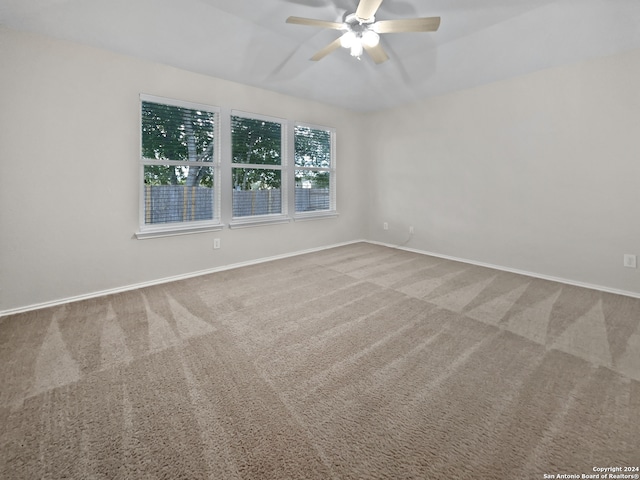 carpeted empty room with ceiling fan