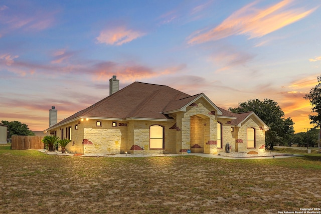 view of front of home with a yard