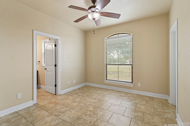 spare room featuring ceiling fan