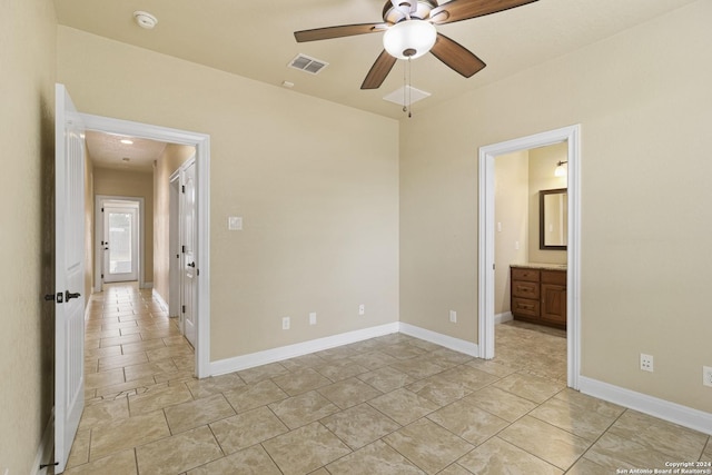 100 Vintage Ranch Cir, La Vernia, TX 78121 - unfurnished bedroom with baseboards, ceiling fan, and connected bathroom