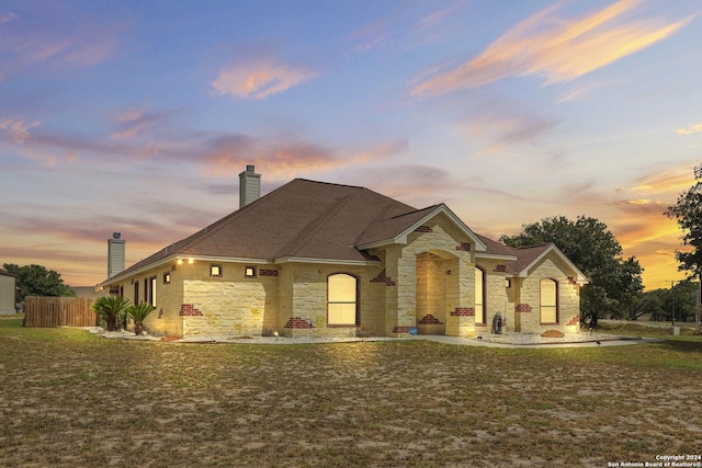 100 Vintage Ranch Cir, La Vernia, TX 78121 - french country style house featuring a chimney and stone siding