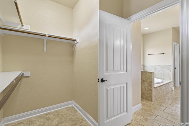 100 Vintage Ranch Cir, La Vernia, TX 78121 - spacious closet featuring light tile patterned floors