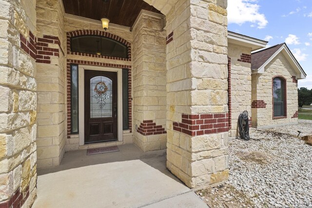 100 Vintage Ranch Cir, La Vernia, TX 78121 - doorway to property featuring stone siding