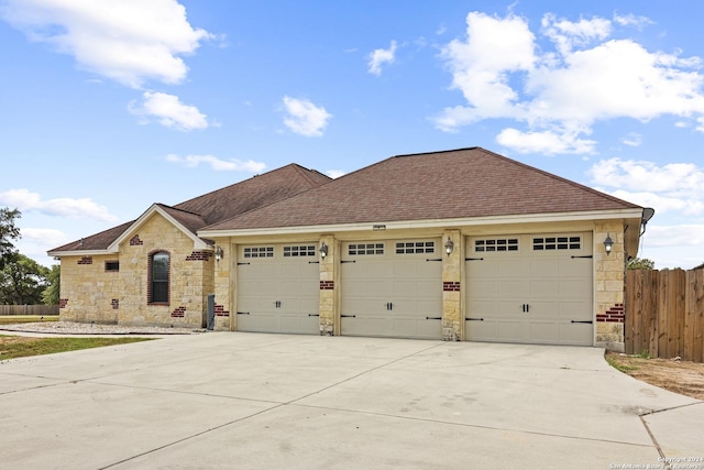 100 Vintage Ranch Cir, La Vernia, TX 78121 - view of front of property with stone siding, an attached garage, fence, and driveway