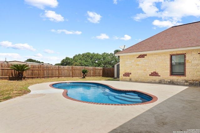 view of swimming pool featuring a patio area