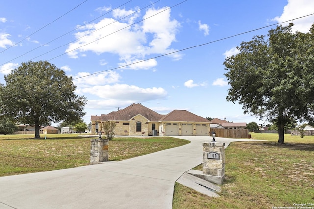 100 Vintage Ranch Cir, La Vernia, TX 78121 - ranch-style home featuring driveway and an attached garage