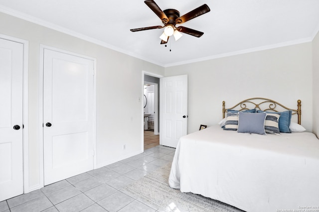 tiled bedroom featuring ornamental molding and ceiling fan