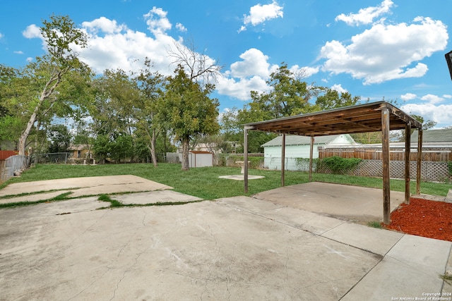 view of patio featuring a storage shed