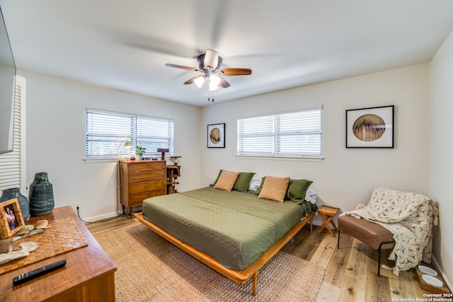 bedroom featuring light hardwood / wood-style flooring and ceiling fan