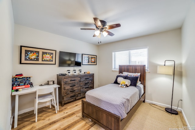 bedroom with light wood-type flooring and ceiling fan