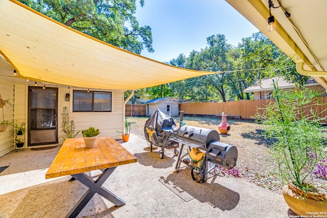 view of patio with a storage shed