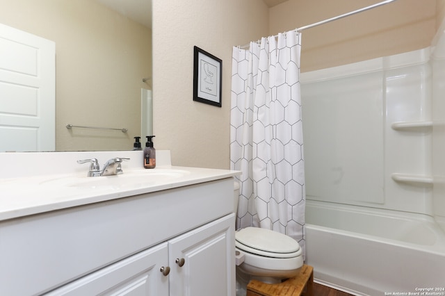 full bathroom with hardwood / wood-style floors, shower / tub combo with curtain, vanity, and toilet