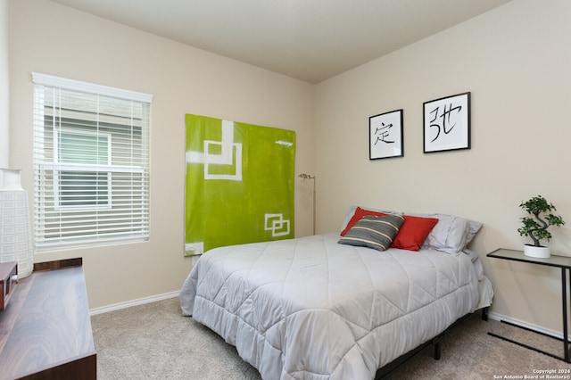 bedroom with light carpet