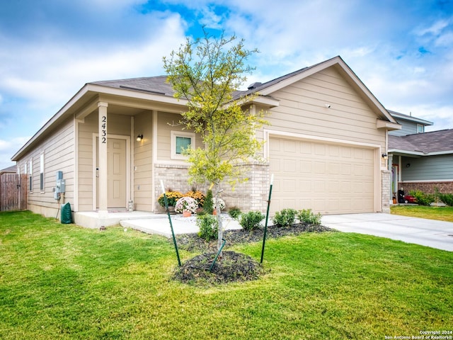 view of front of house with a garage and a front lawn