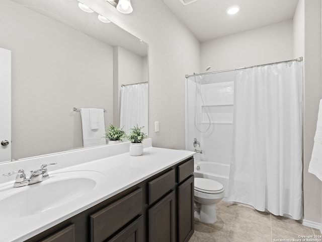 full bathroom featuring toilet, shower / tub combo with curtain, vanity, and tile patterned floors