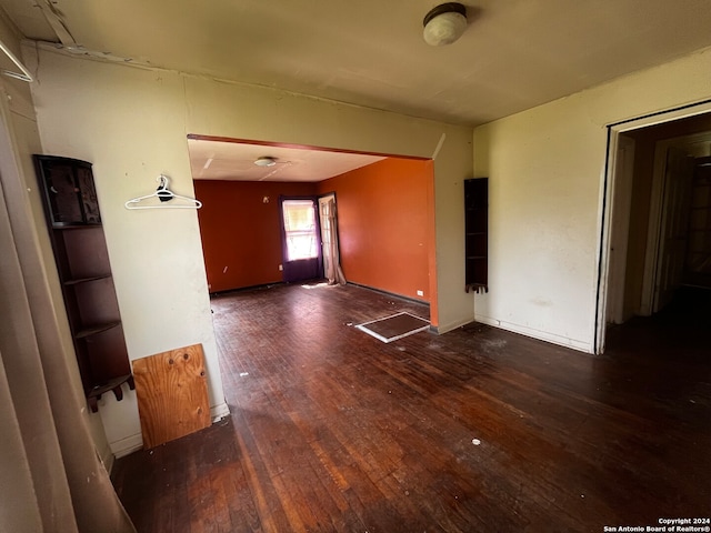 spare room featuring dark hardwood / wood-style flooring