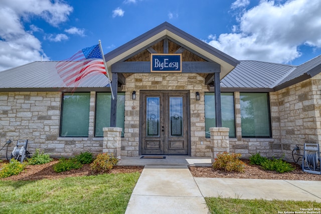 property entrance featuring french doors