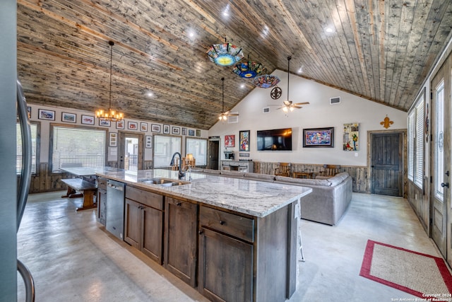 kitchen featuring high vaulted ceiling, sink, hanging light fixtures, a kitchen island with sink, and stainless steel dishwasher