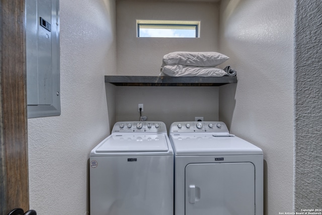 washroom with electric panel and independent washer and dryer