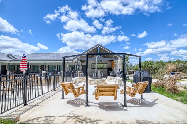 exterior space featuring a grill and a fire pit