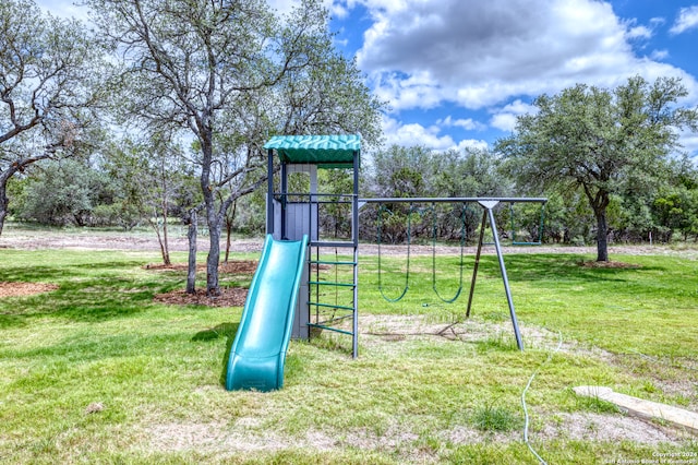 view of playground with a yard