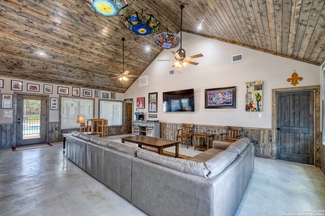 living room with ceiling fan, wooden ceiling, high vaulted ceiling, and wood walls