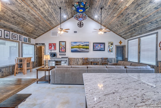 living room with ceiling fan, wooden ceiling, and high vaulted ceiling