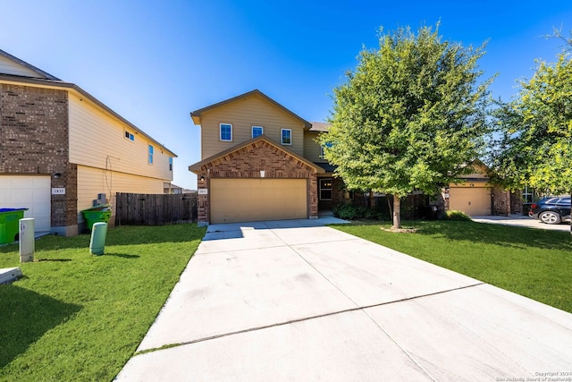 view of front facade with a garage and a front lawn