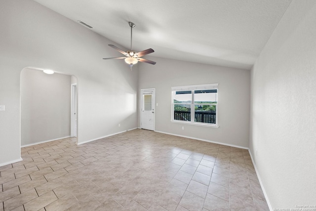 tiled empty room featuring high vaulted ceiling and ceiling fan