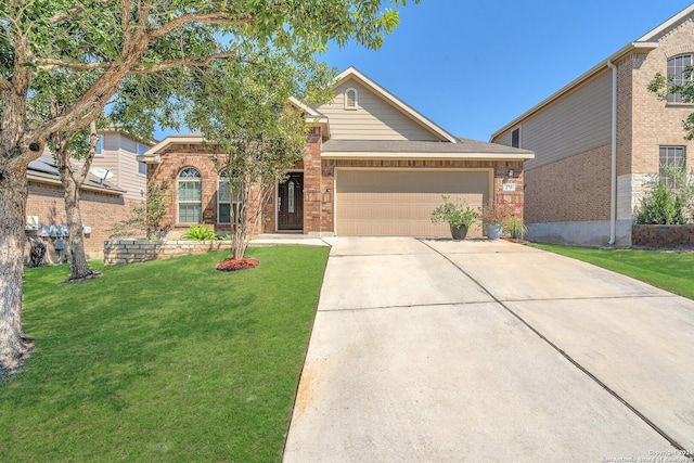 view of front of property featuring a garage and a front yard